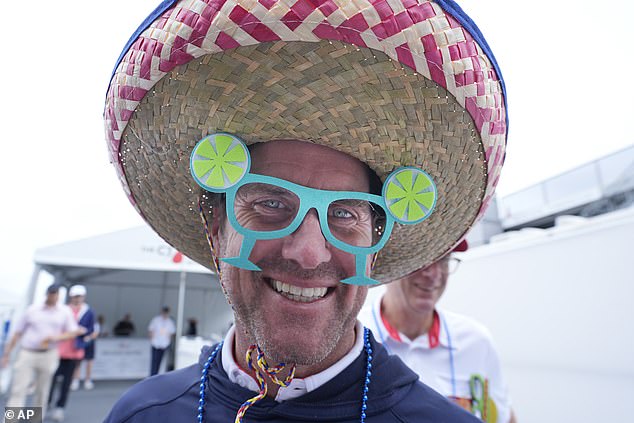 A Dallas man was seen sporting a large hat with teal daisy-themed glasses during the final round of the Byron Nelson golf tournament in McKinney, Texas.