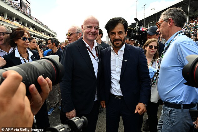 President of the FIA.  Mohammed Ben Sulayem and the president of FIFA.  Gianni Infantino poses for a photo on the grill