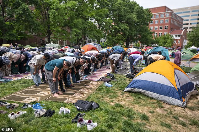 Students on college campuses across the United States have set up pro-Palestinian camps and rallies over the past few weeks to intensify calls for a ceasefire from Israel. Pictured: Protesters participate in prayer at the anti-Israel camp at George Washington University in DC on Friday, May 3.