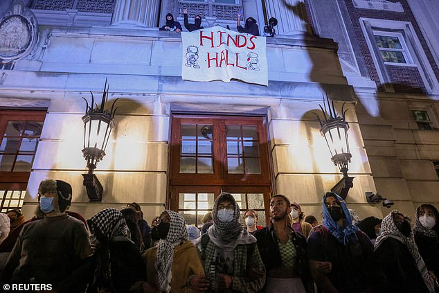 Protesters join arms in front of Hamilton Hall to block students inside the Columbia University building on April 30.