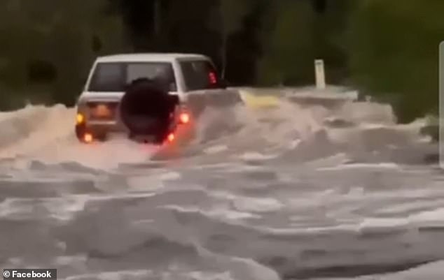 Heavy rain further north caused flooding in parts of Queensland and a captured 4x4 vehicle was swept away by raging waters at Weerriba on Saturday.