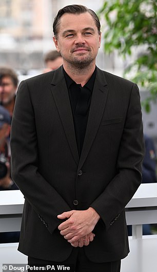He was first seen with his hand on his butt during the filming of the Paul Thomas Anderson film.  The two were then photographed hugging at an Oscars party;  He is pictured on April 11.