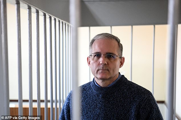 Paul Whelan, a former US Marine accused of espionage and arrested in Russia, stands inside the defendants' cage during a hearing in a Moscow court on August 23, 2019.