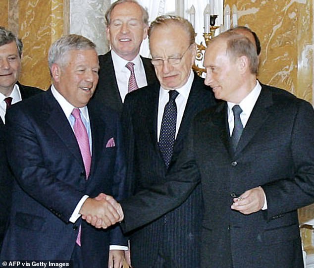 In this image of Kraft shaking Putin's hand, the leader holds the ring in his other hand.