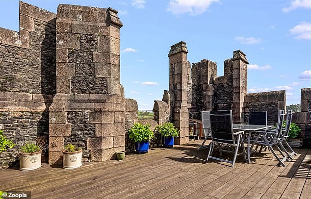 The penthouse has its own private terraced terrace and is surrounded by turrets.