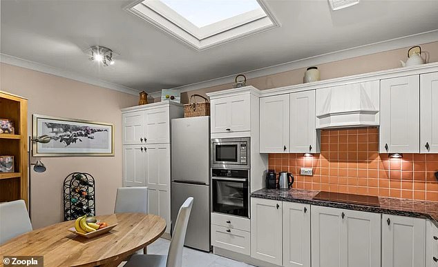 The attic kitchen has a skylight that lets plenty of light into the space.