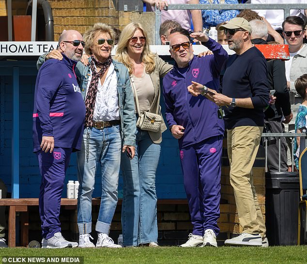Actor Ray, 67, ditched his usual coiffed gray hair and donned a bright purple tracksuit as he was seen on the pitch supporting the match.