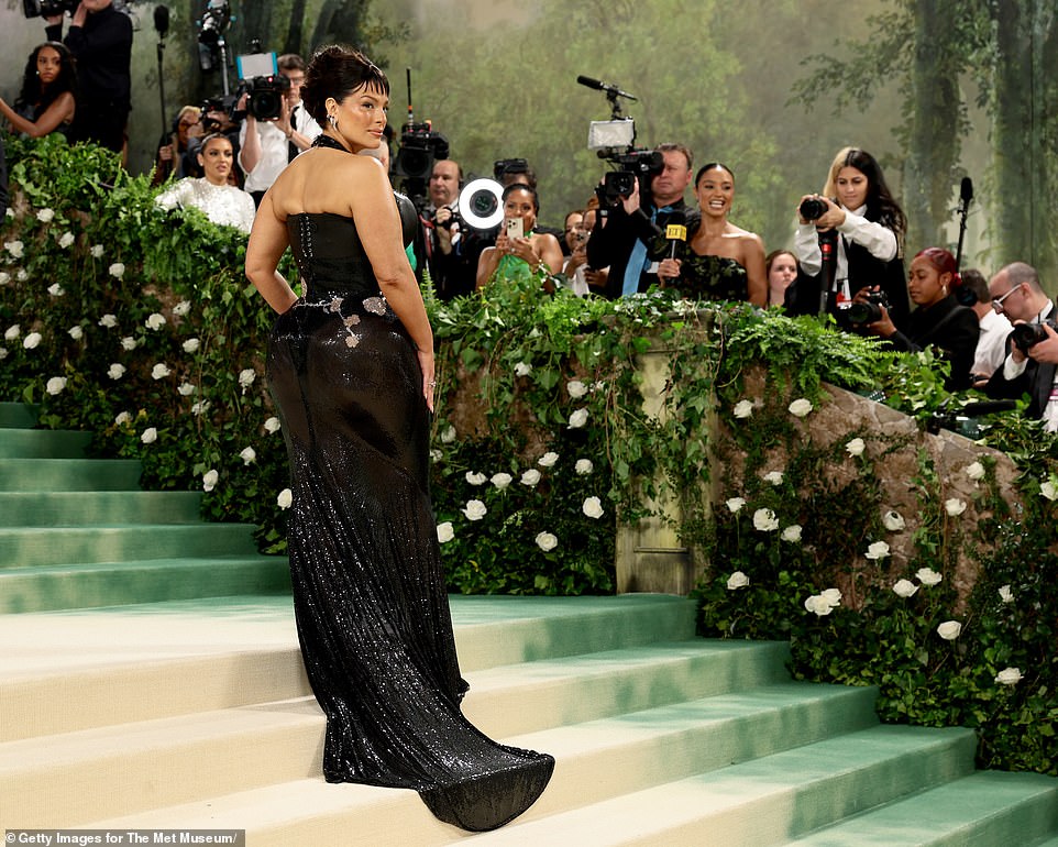 The model caused a sensation with her dramatic look, which included very short bangs, as she headed up the famous stairs of the glamorous event.