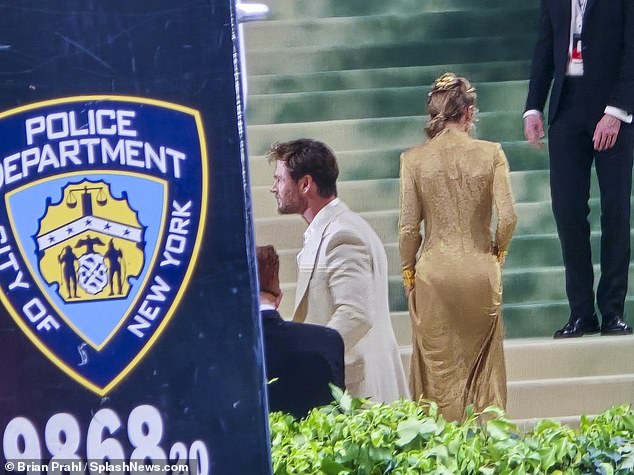 Actor Chris Hemsworth and his wife make a grand entrance under tight security from the New York Police Department at the Met Gala in New York City.