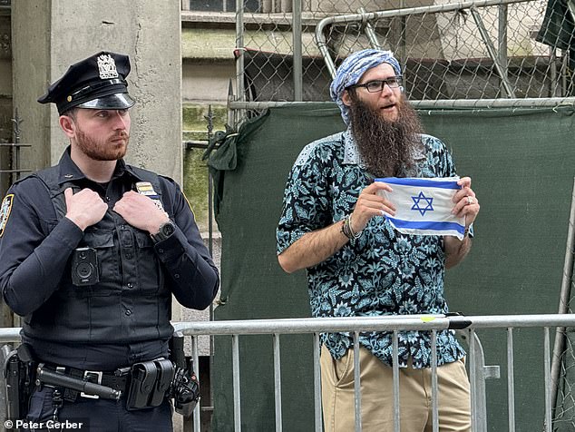 NYPD officers set up barricades outside the entrance to Hunter College at East 68th Street and Lexington Avenue starting at 3 p.m. Monday.