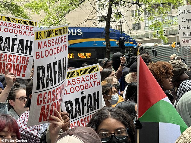 The protesters carried a multitude of Palestinian signs and flags.