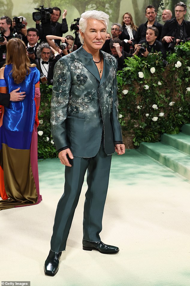 Baz certainly dressed the part in a pine green suit that featured floral embroidery on the jacket.