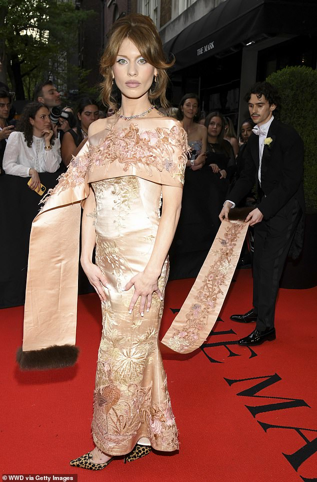 Ivy was not only accompanied by Conner, who is seen fixing her train outside The Mark hotel in New York, but he also designed her dress for the evening.