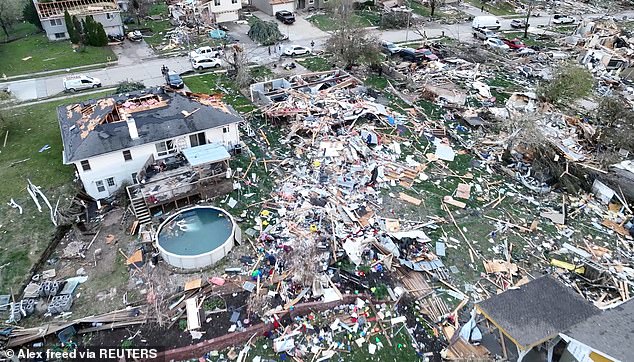 A drone view shows people inspecting the site of damaged buildings after a tornado in Omaha, Nebraska, on April 26.