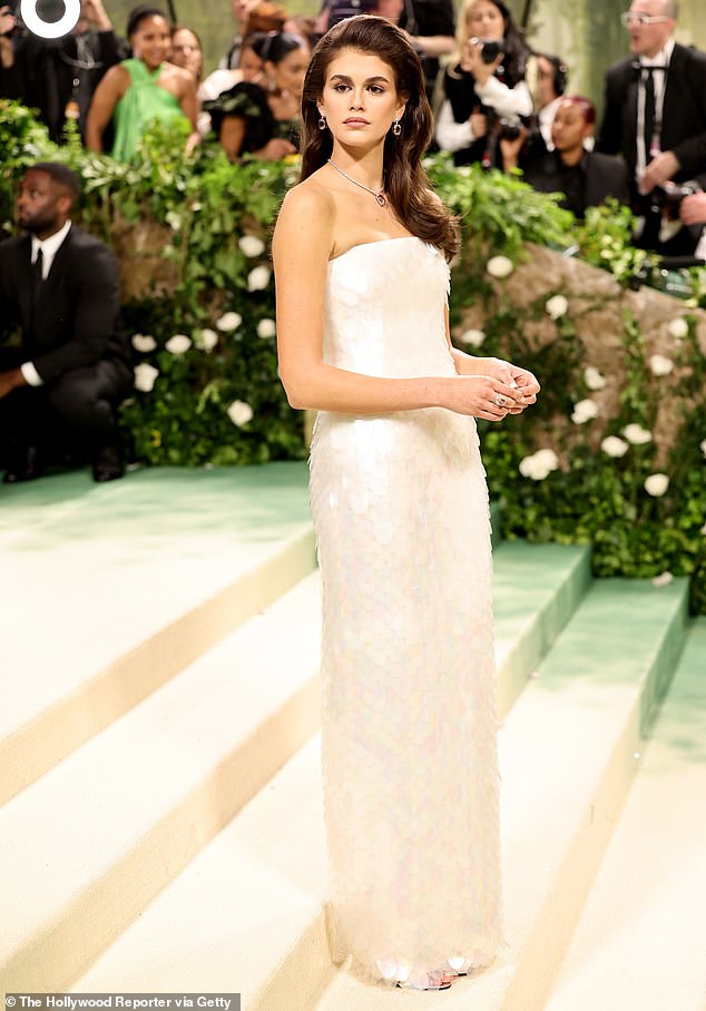 The Palm Royale actress donned a figure-hugging Prada dress made from a dazzling white sequin material.