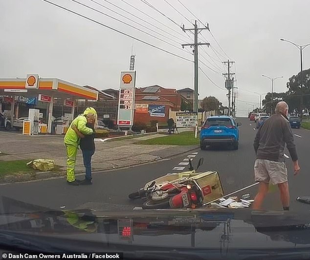 The driver of the blue car hugged the courier after he collided with her