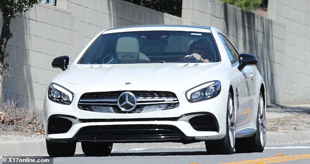 The 42-year-old pop superstar was spotted behind the wheel of her white Mercedes while driving around her hometown of Thousand Oaks.