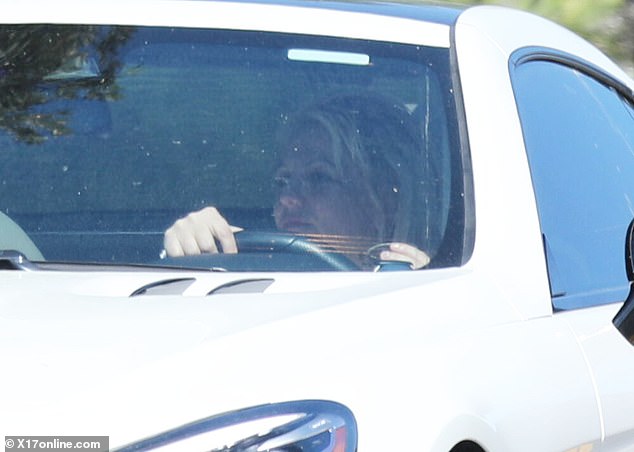 Britney seemed to be in great spirits and flashed a soft smile while behind the wheel.