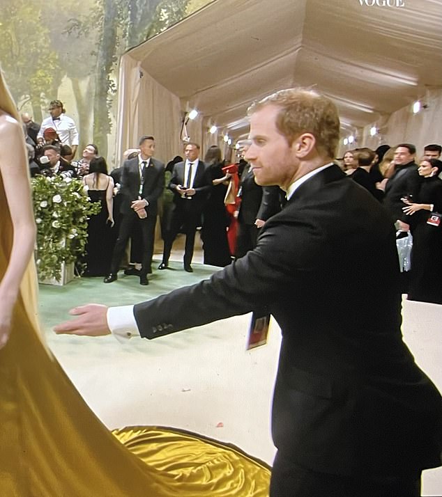 A member of staff who looked remarkably like the Duke of Sussex was smartly dressed and on hand to help carry and fit the dress of actress Elizabeth Debicki, who played Princess Diana in the Netflix series The Crown.