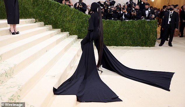 Kim still wore a bit of it with Kanye to the 2021 Met Gala, completely hiding her body and face in a skin-tight black suit designed by Balenciaga, Ye's frequent collaborator.