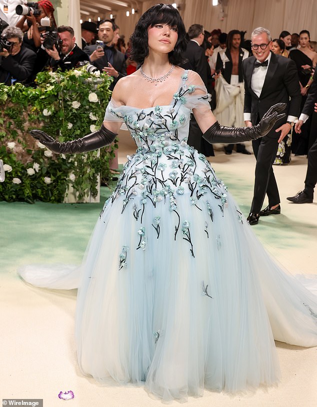 She looked stunning in a light blue one-shoulder tulle Miu Miu dress that fell to a full skirt to skim the floor.