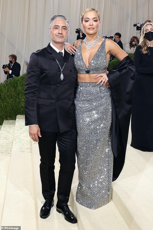 The singer showed off a sparkling silver DeBeers band on her engagement finger while nuzzling Taika Waititi at the Met Gala.