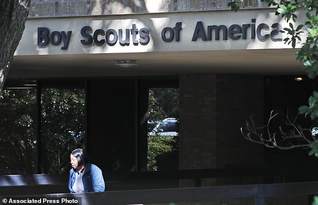 A woman leaves the Boy Scouts of America national headquarters building in Irving, Texas, on Nov. 1, 2019.