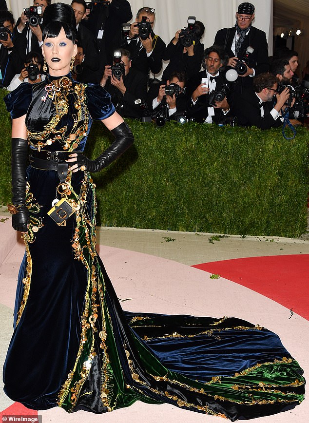 Katy Perry is pictured attending the 2016 Met Gala wearing a dress she claimed was so big it would be difficult to use the bathroom, suggesting she could even wear an adult diaper.