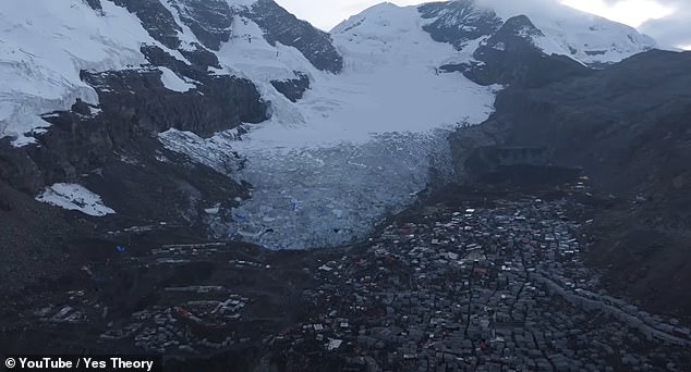 Drone footage shows how the ramshackle town, which sits at around 16,700 feet, is nestled in the middle of mountains, but ruining its beauty are dozens of mining pits, as the area is rich in gold.