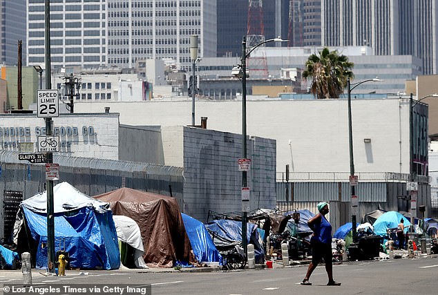 Tents housing homeless people line the sidewalk along Fifth Street in downtown Los Angeles.