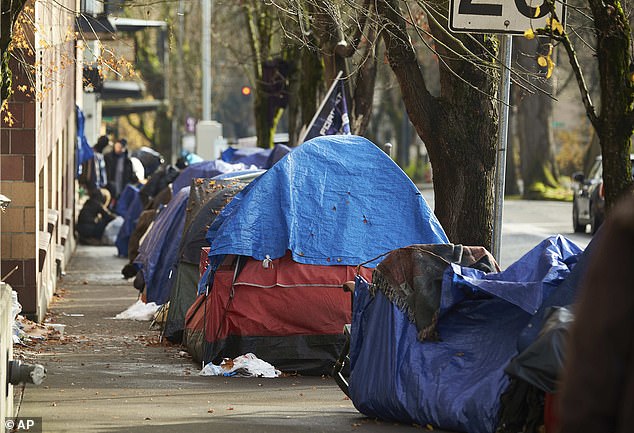 Tents line the sidewalk on Clay Street on December 9, 2020, in Portland, Oregon.