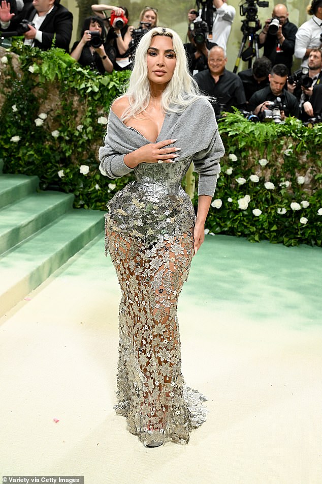 Khloe said of her sister Kim, who wore a custom Maison Margiela: 'I'm NOT fine!!!!!! Holy smoke Batman