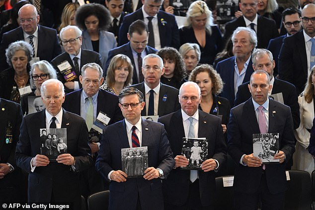 President Joe Biden, House Speaker Mike Johnson, House Majority Leader Steve Scalise and House Minority Leader Hakeem Jeffries hold images of the victims of the Holocaust during the annual Holocaust Survivor Days of Remembrance ceremony at the United States Capitol.