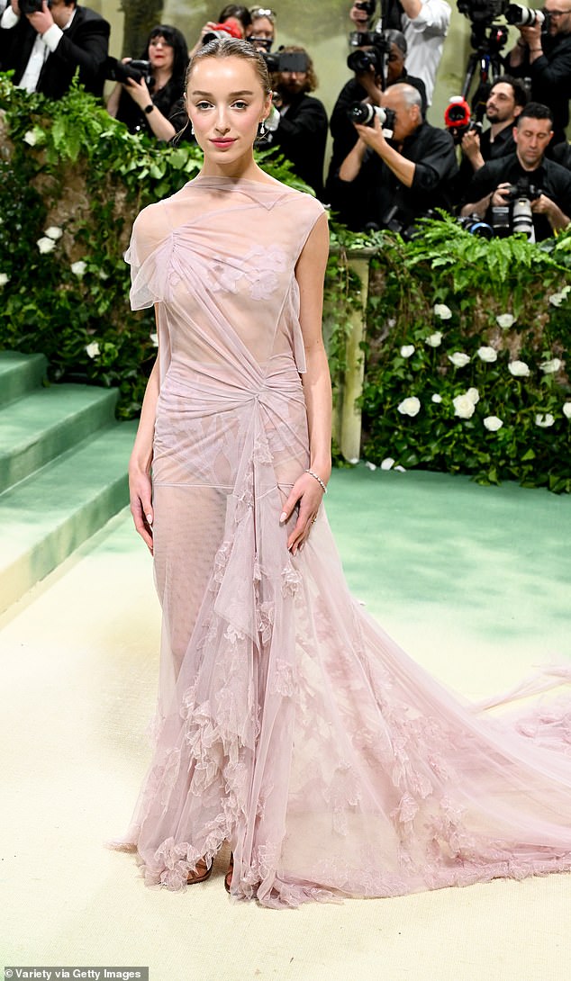 Phoebe, who became the first star to wear a Victoria Beckham design at the Met, opted for a similar pale pink dress that featured a lace-up floral design and a long train.