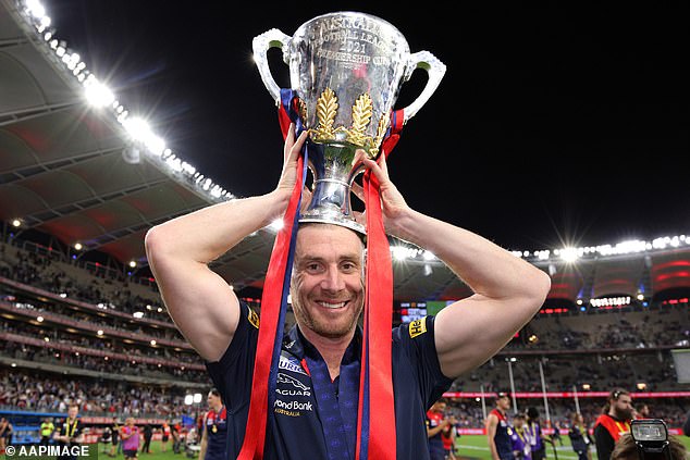 Goodwin won the 2021 AFL banner with Melbourne (pictured at Optus Stadium in Perth after beating the Western Bulldogs)