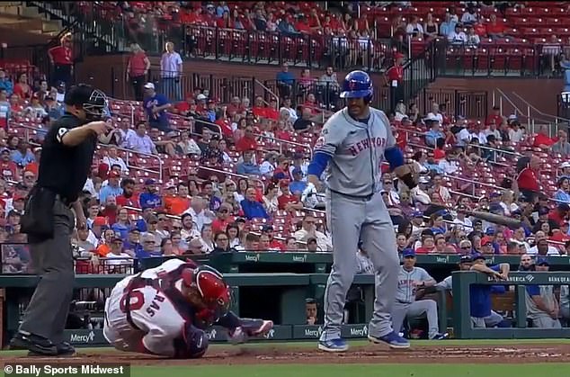 Contreras writhed in pain after Martinez's bat accidentally hit him.