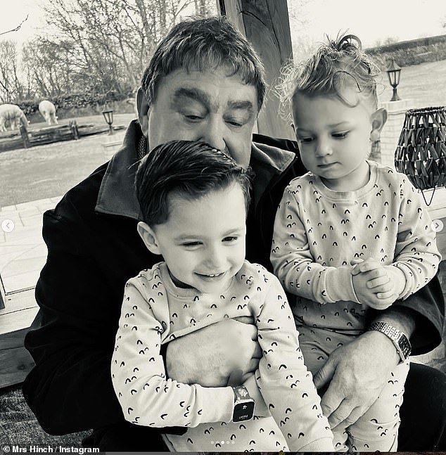 The influencer shared this loving photo of her father with his grandchildren Ronnie, four, and Lennie, two.