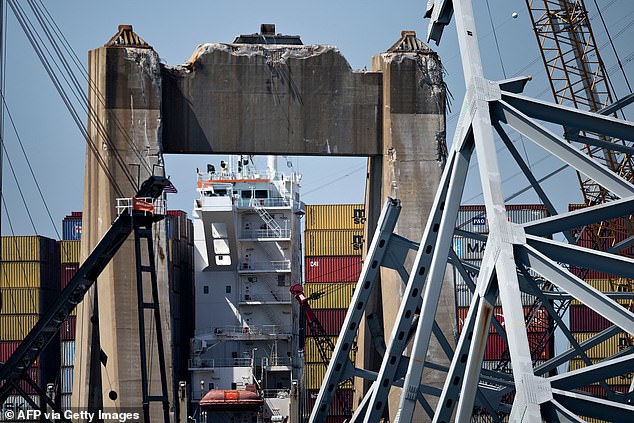 The Dali Freighter Bridge is seen through the remains of the Key Bridge