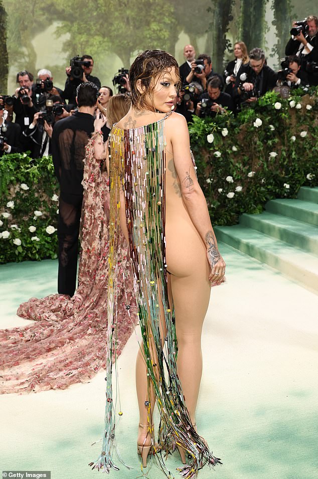 Arriving on the red carpet, the Body On Me singer put on a very daring display in a sheer nude bodysuit underneath an intricately beaded dress, left open at the sides.