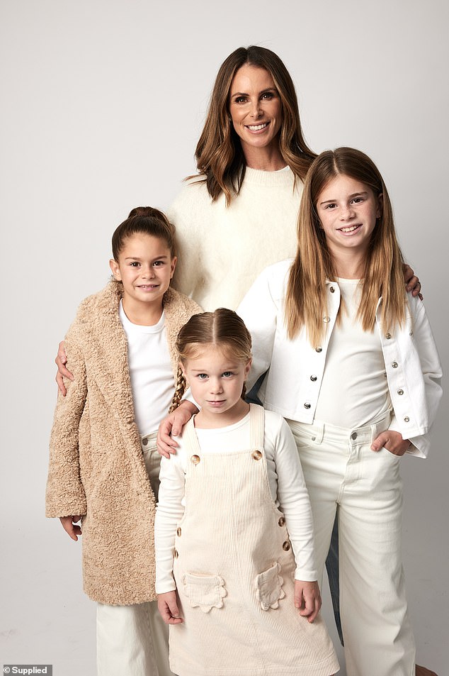 The three girls looked just like their famous mother while wearing almost identical cream and white ensembles.