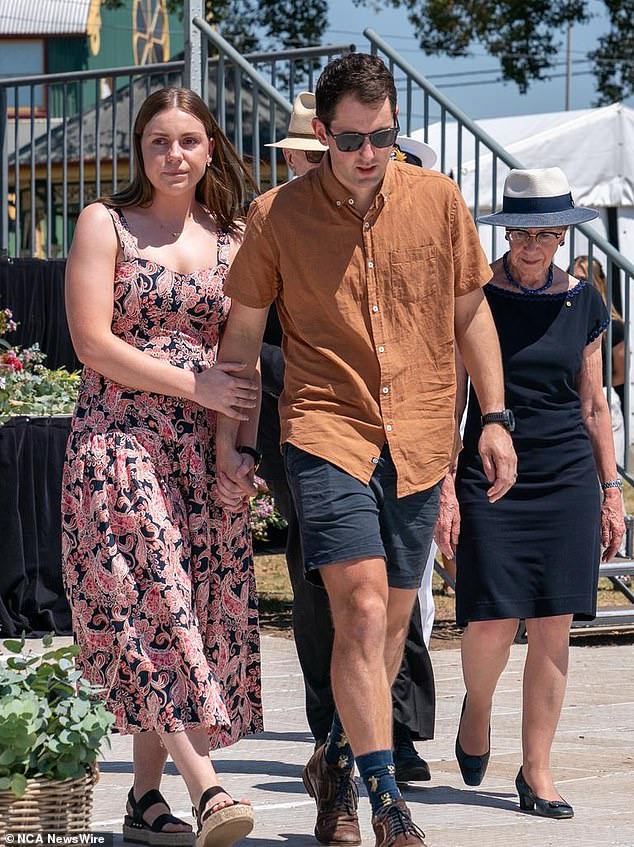 Bride and groom Mitchell Gaffney and Madeleine Edsell at a public memorial to those affected by the bus accident.