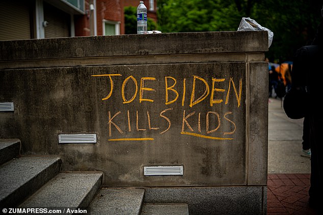 Many of the protesters have directed their fury at President Biden, seen in graffiti on the GWU campus on April 27.