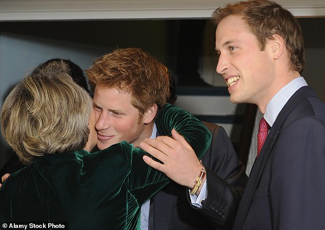 Prince Harry hugs Claire van Straubenzee as Prince William watches as both children launched the Henry van Straubenzee Memorial Fund in 2008.