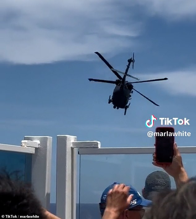 Cruise passengers watched from the deck as the helicopter left the Carnival Venezia, with the patient and his mother on board, and headed to the hospital.