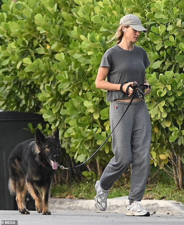The Brazilian bombshell rocked a gray crop top and matching sweatpants as she pulled down her baseball cap.