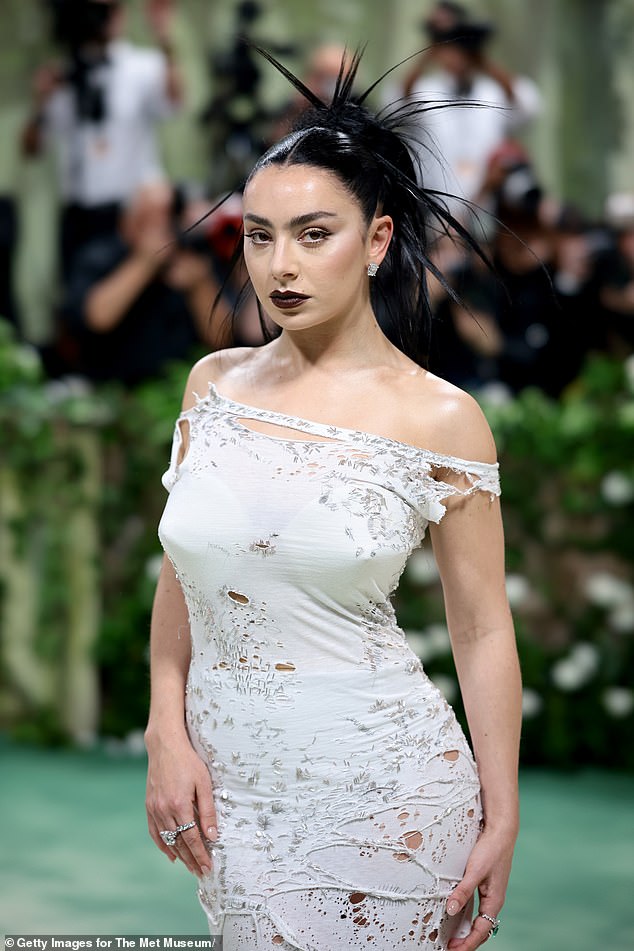 The singer, 31, looked nothing short of sensational in a long off-white dress designed by Marni.
