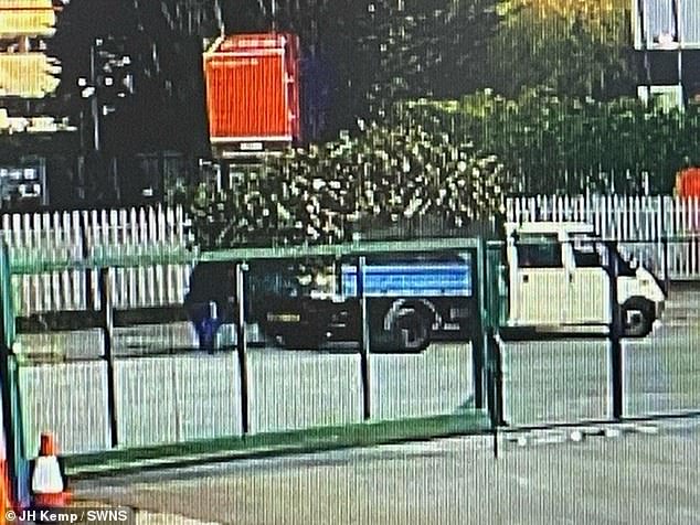 The van then accelerates, leaving the road partially blocked by piles of green waste.