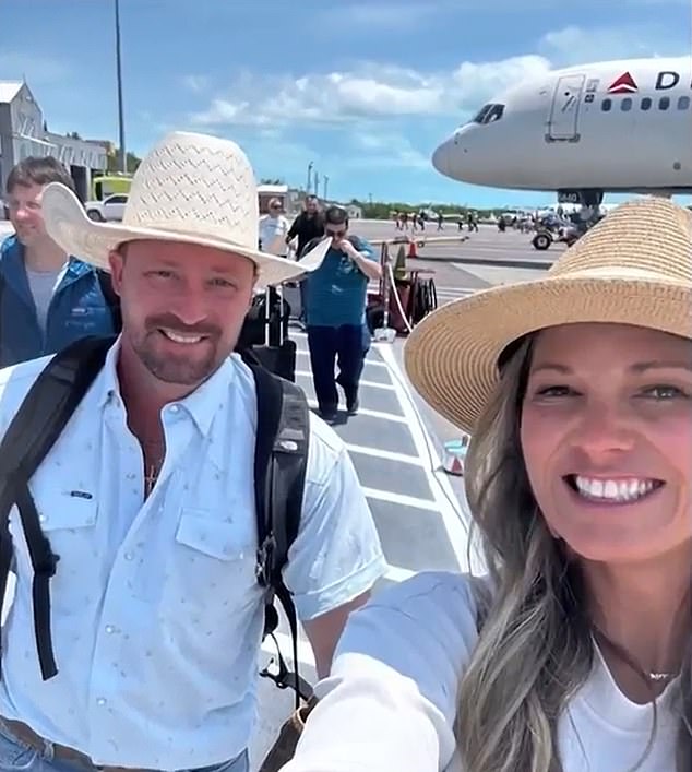 Ryan Watson and his wife Valerie (pictured together arriving on vacation in the Turks and Caicos Islands) were arrested on April 11, but their charges were later dropped and they were allowed to return to their children.