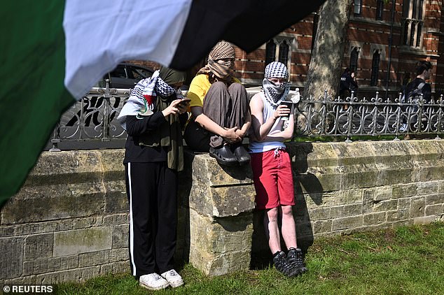 Pro-Palestinian protesters stand outside Oxford University's Natural History Museum, as students occupy parts of British university campuses to protest in support of Palestinians in Gaza.