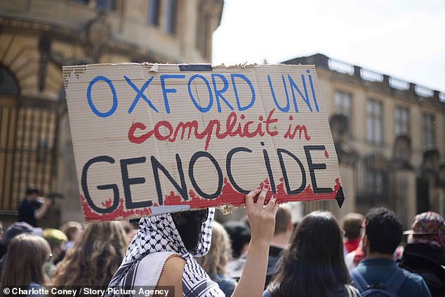 Palestine supporters hold an emergency rally outside the Sheldonian while an event takes place inside